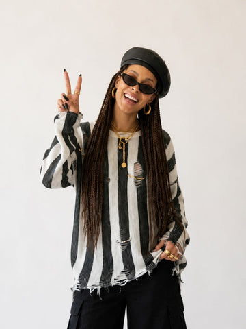 Audacious Striped Distressed Knit Sweater